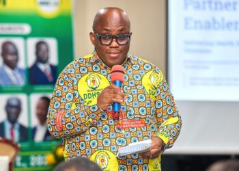 Dr. Victor Asare Bampoe, Chief Executive Officer of the National Health Insurance Authority (NHIA), speaking at the function