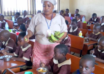 School pupils in Nigeria being fed during school hours