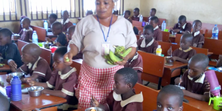 School pupils in Nigeria being fed during school hours