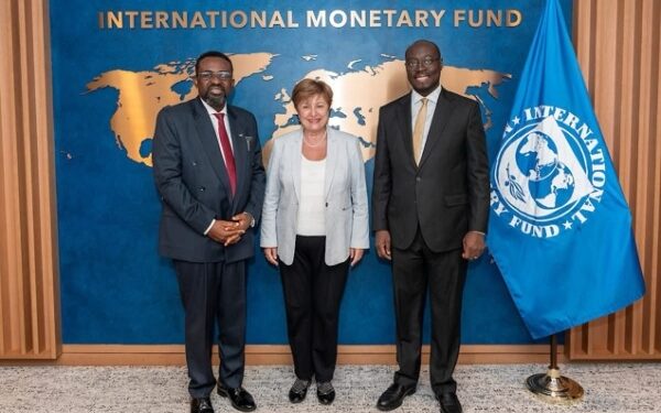 Governor of the Bank of Ghana, Dr Johnson Asiama (left) with an official from the IMF. The Minister of Finance, Dr Ato Forson is on the right
