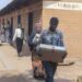 Malawi Electoral Commission (MEC) officials carry voting materials at Kalambo Primary School Polling Centre in Lilongwe, on September 15, 2025. © Photo by Amos GUMULIRA / AFP