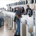Passengers get checked in at the Winnipeg airport. The number of new Canadian citizens being added to the population has slowed to a crawl, Statistics Canada data shows. (John Woods/The Canadian Press)