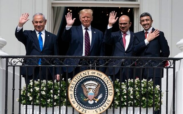 (L-R) Prime Minister Benjamin Netanyahu, US President Donald Trump, Bahraini Foreign Minister Khalid bin Ahmed Al Khalifa and United Arab Emirates Foreign Minister Abdullah bin Zayed al-Nahyan pose for a photo on the Blue Room Balcony after signing the Abraham Accords during a ceremony on the South Lawn of the White House in Washington, September 15, 2020. (AP Photo/Alex Brandon, File)