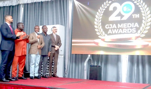 Felix Kwakye Ofosu (centre), Minister for Government Communications, launches the 29th Ghana Journalists Association (GJA) Awards, joined by GJA President Albert Kwabena Dwumfour (second left), Oheneba Kwaku Duah (left), Managing Director of Ashanti Green Initiative, and other dignitaries.