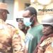 Inspector Ahmed Twumasi (in polo shirt) being guarded by Prison Officers. (PHOTO CREDIT: Myjoyonline)