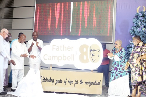 Sam Okudzeto (3rd from left) being assisted by Nana Appiagyei Dankawoso I (right), Chief, Asante Juaben Traditional Area, Dr Joyce Aryee (2nd from right), Rev. Father Andrew Campbell (left) and Dr Mahamudu Bawumia (2nd from left) to unveil the Father Andrew Campbell @ 80 logo