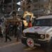 A Red Cross vehicle arrives at the site where members of the Hamas militant group work on searching for bodies of the hostages in an area in Khan Younis, Gaza, Friday, October 17, 2025. © Abdel Kareem Hana, AP
