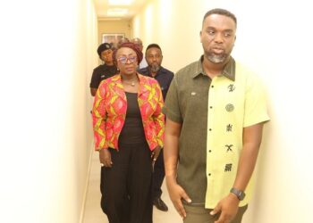Gospel singer Joe Mettle conducting the Tourism minister on his studio