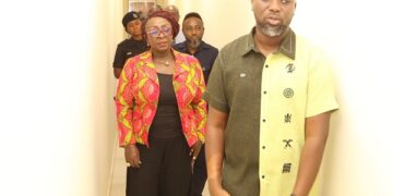 Gospel singer Joe Mettle conducting the Tourism minister on his studio