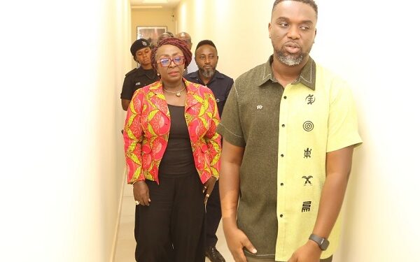 Gospel singer Joe Mettle conducting the Tourism minister on his studio