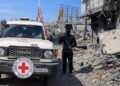 A Palestinian Hamas militant keeps guard as Red Cross personnel head towards Gaza City November 2, 2025. © Dawoud Abu Alkas, Reuters