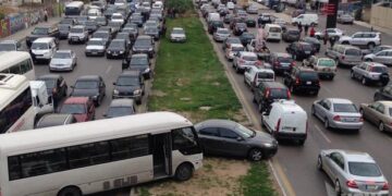 Vehicles stuck in traffic after Israel's military issued 'evacuation' orders of entire neighborhoods in Beirut's southern suburb on March 5, 2026. © Claudia Greco, Reuters
