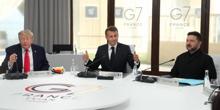 Trump (L) has met with Zelenskyy (R) at the G7 summit hosted by France's Macron (C)